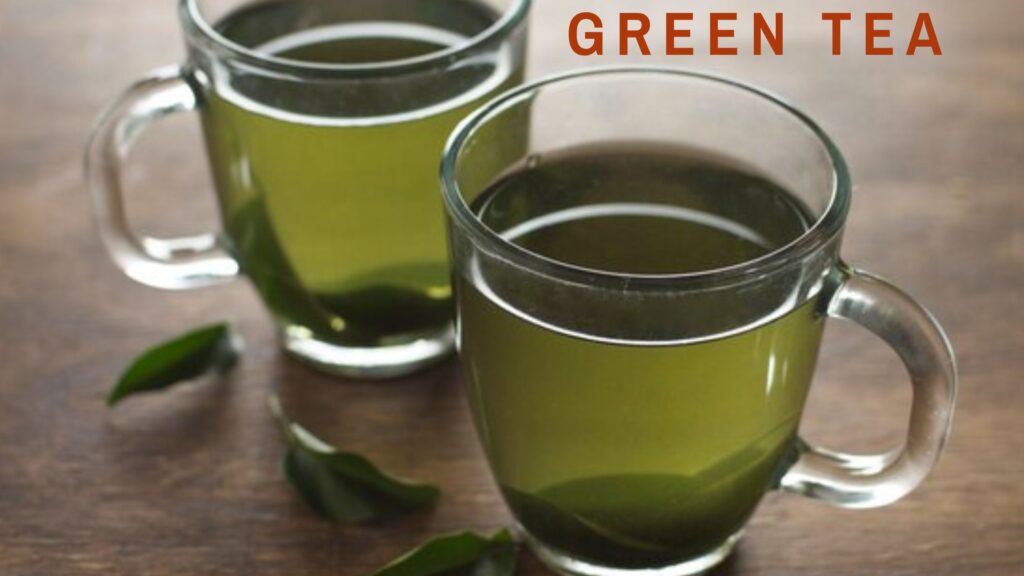 Image of two cups of green tea, a popular drink known to help reduce cholesterol levels naturally