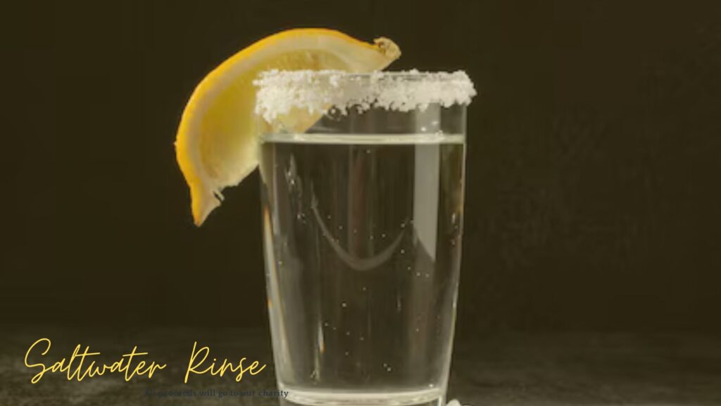 A glass of saltwater with a lemon slice on the rim, used for a saltwater rinse Tooth Cavity